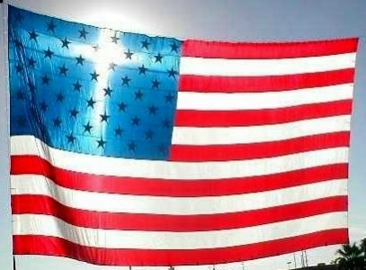 cross shining through american flag