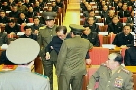 In an image taken from footage shown by North Korea's KCTV and released by South Korea's Yonhap news agency on December 9, 2013, Jang Song-Thaek is reportedly being dragged away from his chair by two police officials during a meeting in Pyongyang. North Korea confirmed on December 9 that the powerful uncle of Kim Jong-Un, the nation's leader, had been removed. New reports from North Korea say that Jang has been executed.