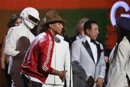 Pharrell Williams, second from left, and Daft Punk accept the award for record of the year at the 56th annual Grammy Awards at Staples Center on Sunday, Jan. 26, 2014, in Los Angeles. (Photo by Matt Sayles/Invision/AP)