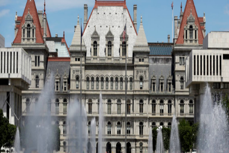 The state Capitol is seen with fountains on the Empire State Plaza on Thursday, July 25, 2013, in Albany, N.Y. (AP Photo/Mike Groll) | ASSOCIATED PRESS