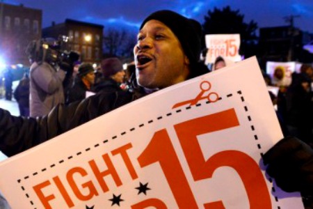 Demonstrators rally for better wages outside a McDonald's restaurant in Chicago, Thursday, Dec. 5, 2013. (AP Photo/Paul Beaty) | ASSOCIATED PRESS
