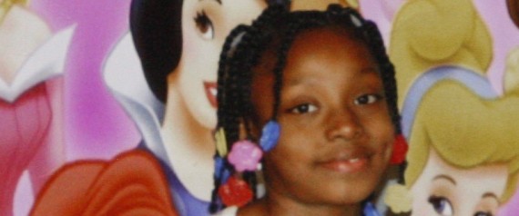 Charles Jones, the father of 7-year-old Aiyana Jones, who was killed early Sunday in Detroit, holds a photo of Aiyana in attorney Geoffrey Fieger's office in Southfield, Mich., Tuesday, May 18, 2010. Fieger, the lawyer for the family of the slain 7-year-old Detroit girl has filed two lawsuits related to a weekend raid that led to her death. Fieger says Detroit police had no legitimate reason to throw a flash grenade into the home of Aiyana Jones early Sunday. He says she was burned by the explos | ASSOCIATED PRESS