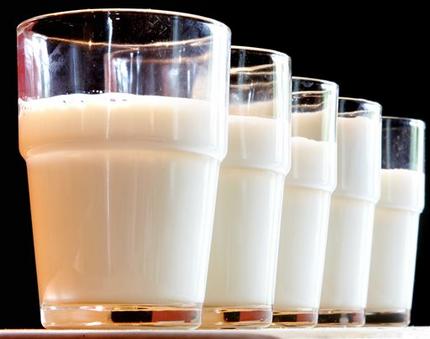 FILE - This Tuesday, July 31, 2007 file photo shows glasses of milk in Frankfurt. In January 2015, embattled U.S. milk producers launched a social media campaign to rebuild public confidence in the health benefits of their product. While the government urges milk consumption, some studies have begun to suggest potential ill effects from drinking too much. (AP Photo/Michael Probst)