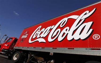 FILE - This Nov. 10, 2010 file photo shows a Coca-Cola delivery truck in Springfield, Ill. Coca-Cola reports quarterly financial results on Tuesday, Feb. 10, 2015. (AP Photo/Seth Perlman, File)