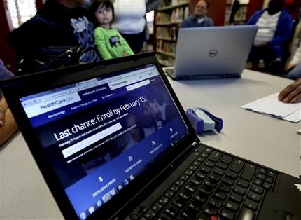 In this Thursday, Feb. 12, 2015 photo, a laptop shows the HealthCare.com web site during an Affordable Care Act enrollment event at the Fort Worth Public Library in Fort Worth, Texas. For the second year in a row, millions of Americans have signed up for subsidized health insurance under President Barack Obama's law. But as the 2015 sign-up season draws to a close Sunday, the future of the Affordable Care Act remains in doubt. (AP Photo/LM Otero)