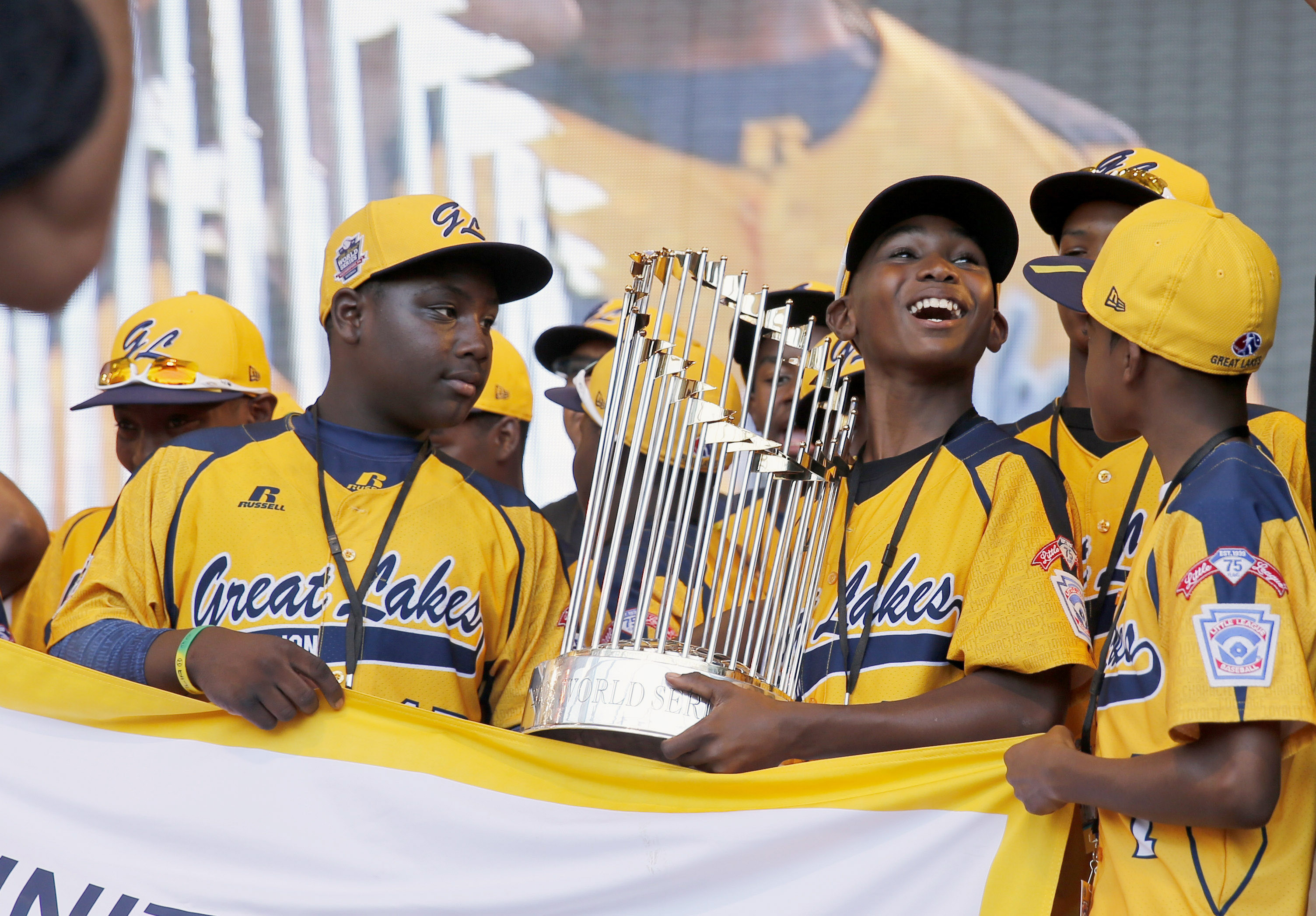 The Jackie Robinson West Little League team celebrates the victories that would soon be taken from them.