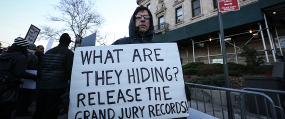 NEW YORK, UNITED STATES - JANUARY 15: Protesters hold banners and shout slogans at the outside of the 120th Police Precinct Station, during a demonstration continues with a candlelight vigil in memory of the Eric Garner, died in New York's Staten Island on 17th of July 2014 after a police officer put him in a chokehold due to an incident, in New York City, NY, United States on January 15, 2015. After the incident, grand jury had not charged the New York City police officer. (Photo by Cem Ozdel/A | Anadolu Agency via Getty Images