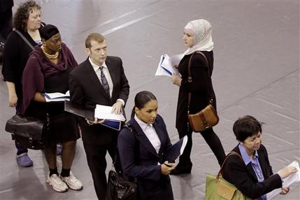 FILE - In this Oct. 8, 2014 file photo, job hunters line up for interviews at an employment fair sponsored by the New York State Department of Labor, in the Brooklyn borough of New York. Associated Press-GfK poll finds Americans' views of Obama have improved slightly in the past two months, as have opinions on the direction of the country and the strength of the economy. Bump up for his handling of unemployment. (AP Photo/Mark Lennihan, File)