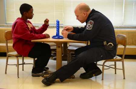 The president, police experts, activists and even some police officers have called for major changes to the American law enforcement system. Community policing -- used in Columbia Heights, Minnesota, where Captain Lenny Austin is seen here mentoring a student in 2013 -- might just be the change police departments need. (Photo: Richard Sennott/Star Tribune/ZUMA Press/Corbis)