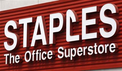 FILE - In this May 17, 2011 file photo, a Staples sign is displayed on the front of a Staple store, in Portland, Ore. Staples is buying Office Depot in a cash-and-stock deal valued at nearly $6 billion. Office Depot Inc. shareholders will receive $7.25 in cash and 0.2188 of a share in Staples Inc. at closing. The deal values Office Depot at $11 per share. (AP Photo/Rick Bowmer, File)