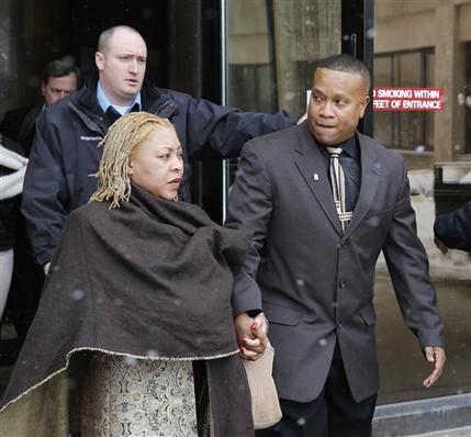 Park Forest Police Officer Craig Taylor, right, leaves the Markham, Ill., courthouse with his wife, Freddie, after being found not guilty in the 2013 beanbag shooting death of 95-year old World War II veteran, Wednesday, Feb. 4, 2015. In a courtroom packed with officers supporting Taylor, Cook County Judge Luciano Panici said there was nothing criminal about Taylor's actions and that the officer did "what he was trained to do."(AP Photo/Charles Rex Arbogast)