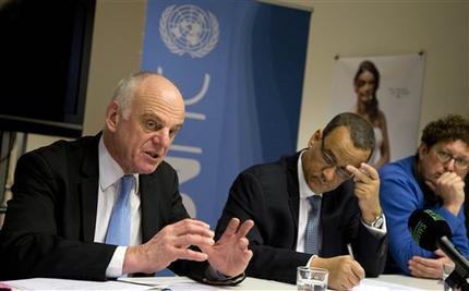 Dr. David Nabbaro, left, a medical doctor organizing the United Nations' response to the Ebola crisis, speaks during a media conference at the UN office in Brussels on Monday, March 2, 2015. African heads of state and NGO's will meet Tuesday to discuss the Ebola crisis. (AP Photo/Virginia Mayo)