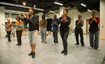 (L to R) Linda Bright Clay, Joslyn Jones, Briana Stuart, Stephen Conrad Moore, Kenn E. Head, Eunice Woods, Anji White and Penelope Walker in rehearsal for American Theater Company's world premiere documentary play "The Project(s)." Image by Michael Brosilow.