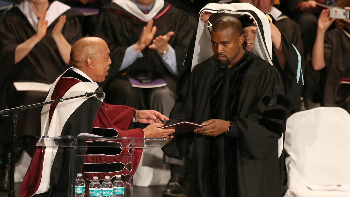 Walter E. Massey, Ph.D.,  President of the School of the Art Institute of Chicago, bestows Kanye West  with a honorary doctorate degree  during its commencement ceremony May 11, 2015.