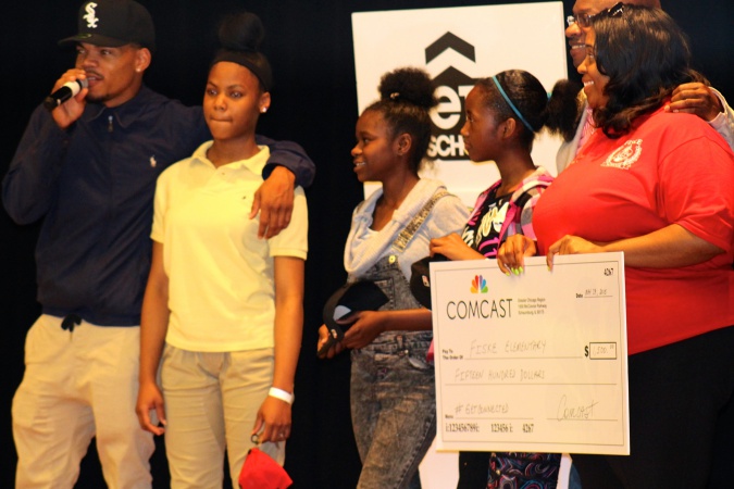 Chance the Rapper presents Comcast Get Connected check to John Fiske School.