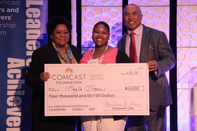 Pictured l-r: Charisse Lillie, President of the Comcast Foundation, Kayla Cooper and Hines Ward, Super Bowl XL MVP