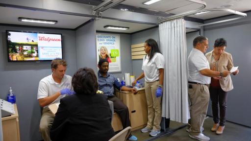 Walgreens Wellness Tour staff serving participants in Chicago