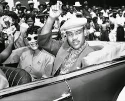 Boxing Champion Joe Louis with his wife in the Bud Billiken