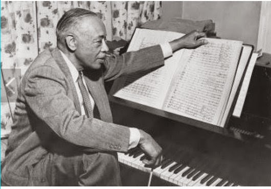 William Grant Still with his sheet music