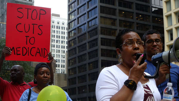 Rep Esther Golar protesting for Medicade