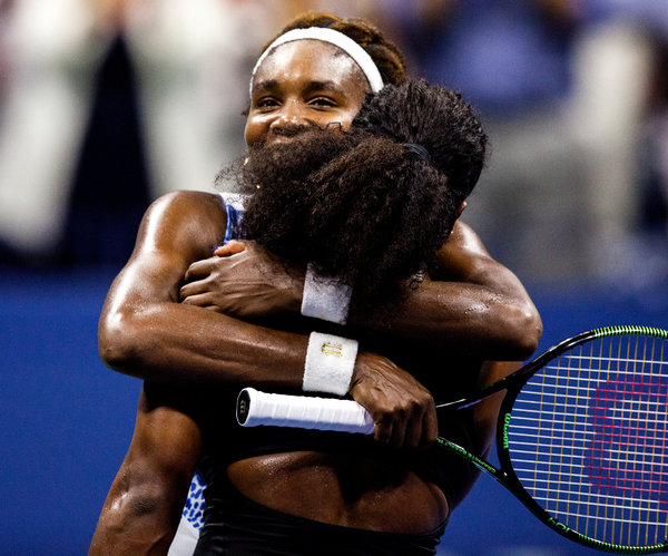 Venus hugs her younger sister after being defeated by her at U.S. Open. 2015