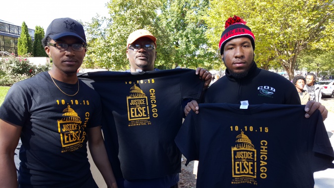 Pictured l-r: Chicago natives, Jonah Jackson, attendee and cousin, Akim Chatman selling "Justice of Else" t-shirts. Photo Credit: Mary L. Datcher