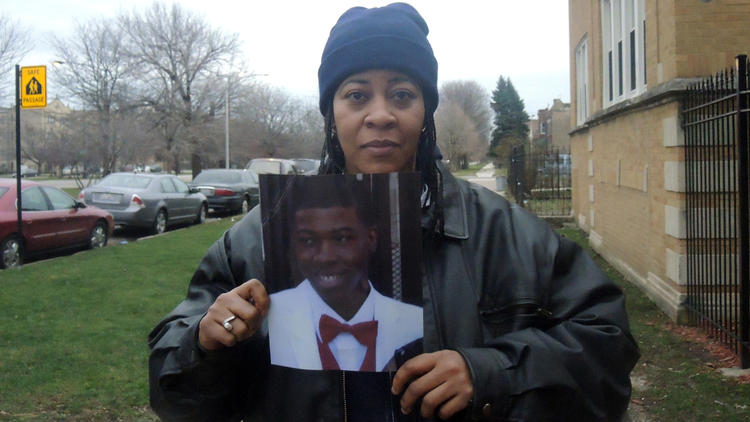 Janet Cooksey holds a photo of her son Quintonio LeGrier, who was fatally shot by police at a West Garfield Park residence Dec. 26, 2015.