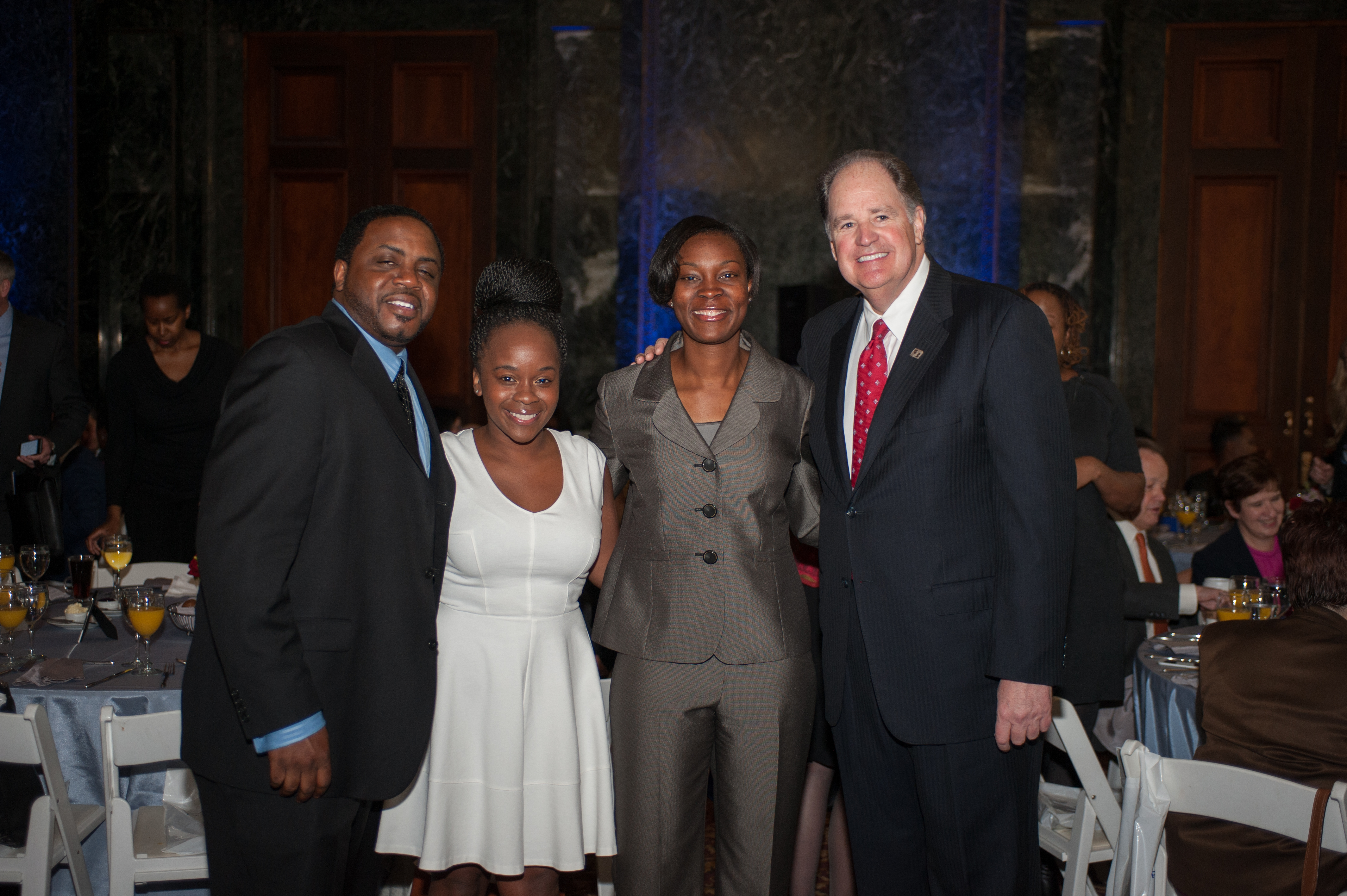 Ethan Zagore, Nijinski Dix, and Fifth Third President Bob Sullivan flank Veteran’s Community Leader honoree Danielle Green (center right), who donated her $5,300 contribution from Fifth Third to U.S. Department of Education’s TRIO Programs