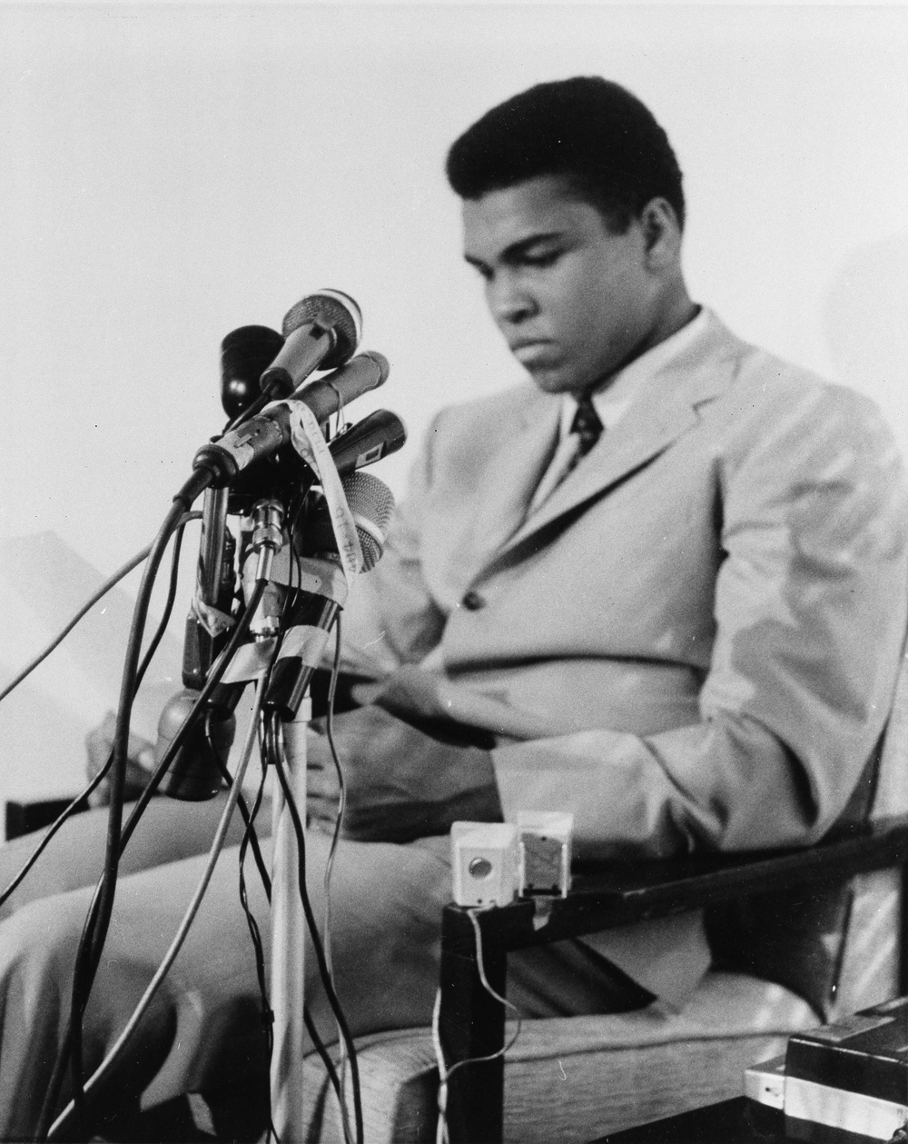 Muhammad Ali is seen at a news conference in Louisville, Kentucky, April 20, 1967, to say he will not accept miltary service of any nature when he is called for induction In Houston on April 28. He said "I ain't got no quarrel with them Viet Cong," and that the real enemy of his people "is right here" and not in Vietnam or anywhere else. (AP Photo)