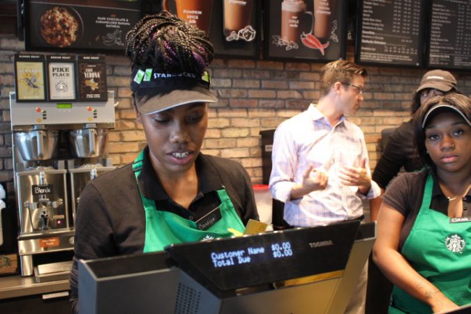 Englewood Starbucks barista takes care of customers. 