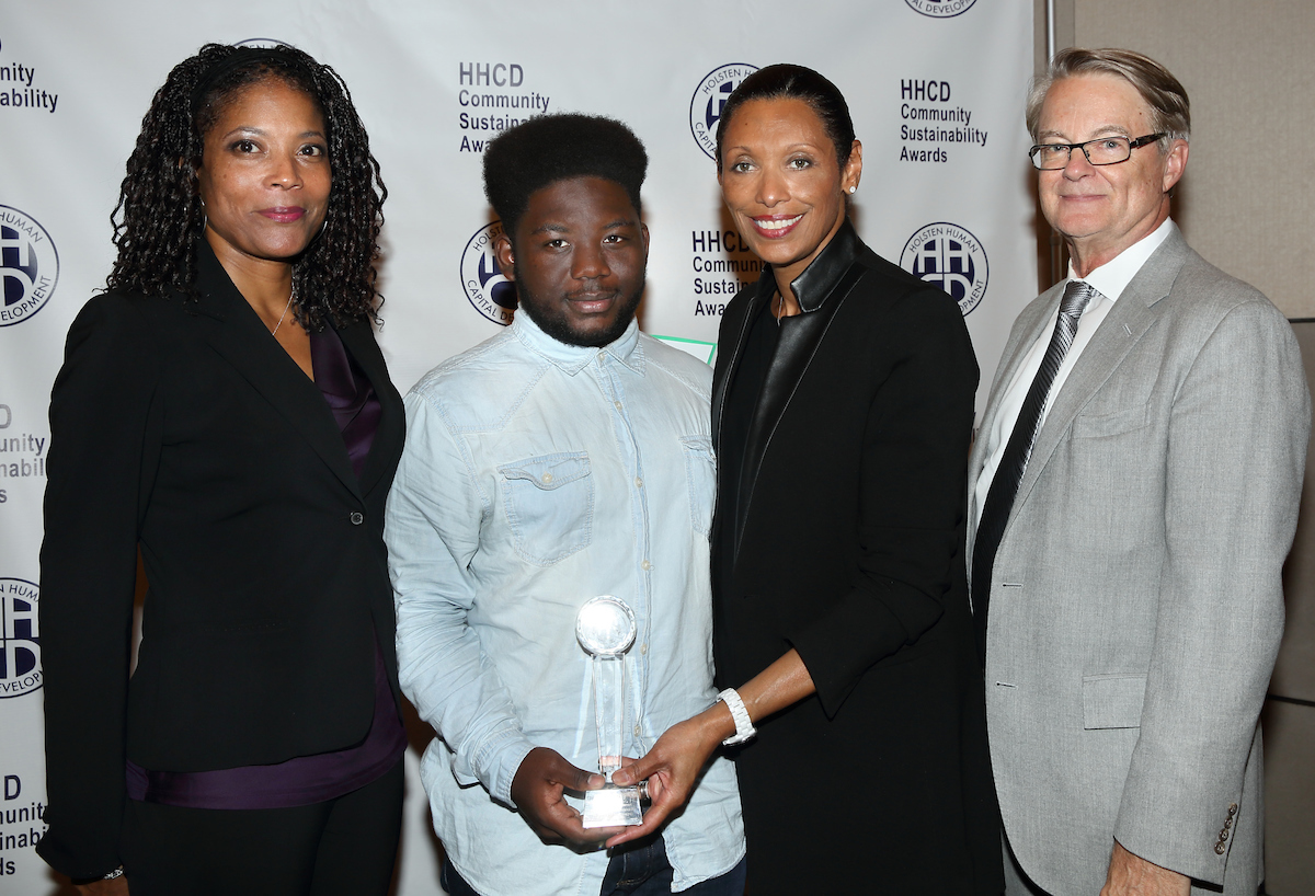 Youth Empowerment honoree Davien Day (center), with HHCD board member Dana Travis (left), and Jackie and Peter Holsten (right)