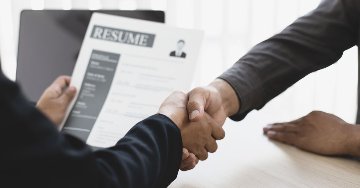 subject is being interviewed by employer to illustrate job growth,
