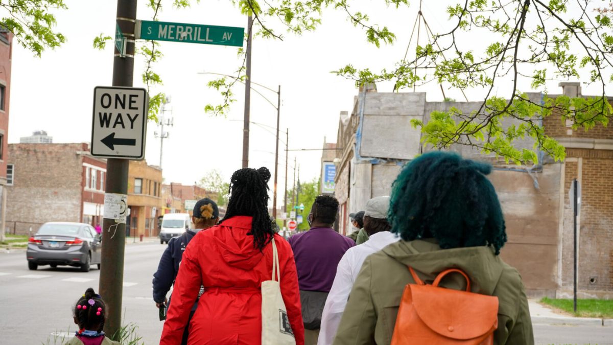Participants walk through Southside Chicago neighborhood