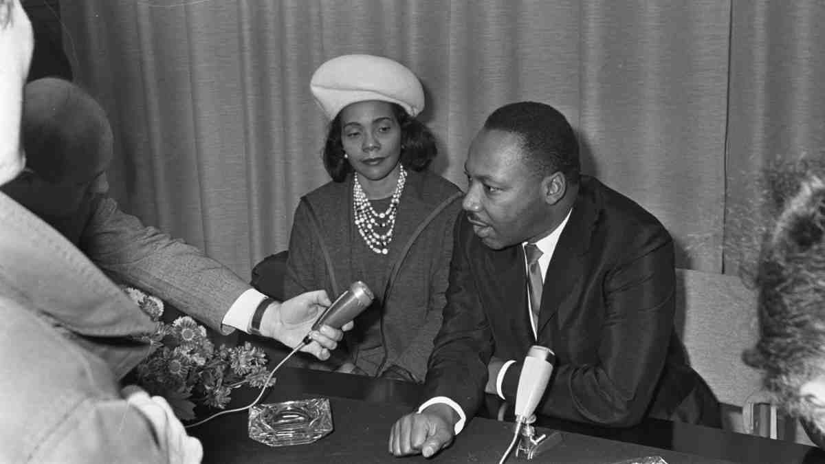 Martin Luther King, Jr., with Coretta Scott King, being interviewed at Schiphol Airport in the Netherlands, October 20, 1965