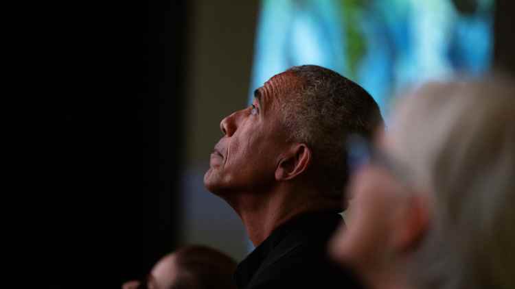 President Barack Obama viewing an exhibit at the Obama Presidential Center
