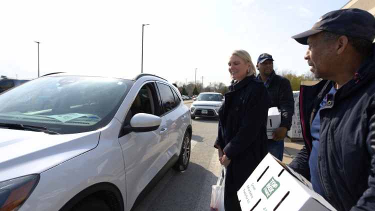 Amy Witherite of 1-800-TruckWreck, Witherite Law Group, and volunteers handed out hams and food boxes for Easter 