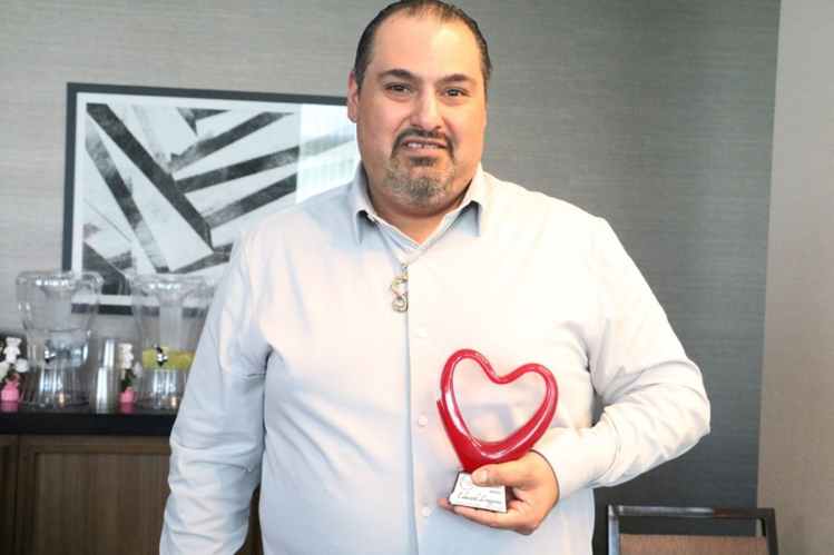 Edward Longoria recipient of the Caregiver Heart Award