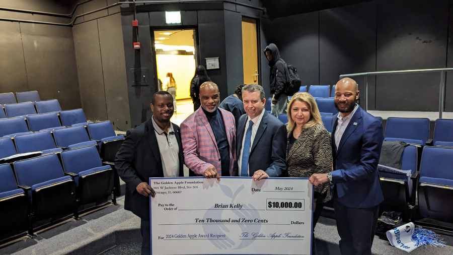 Martin Luther King College Prep Principal Brian Kelly with Golden Apple officials, CPS CEO Pedro Martinez and Ald. Lamont Robinson 