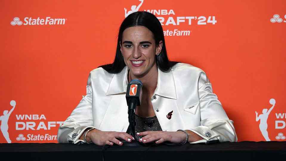 Caitlin Clark addresses the media in her press conference shortly after being selected first overall in the 2024 WNBA Draft 