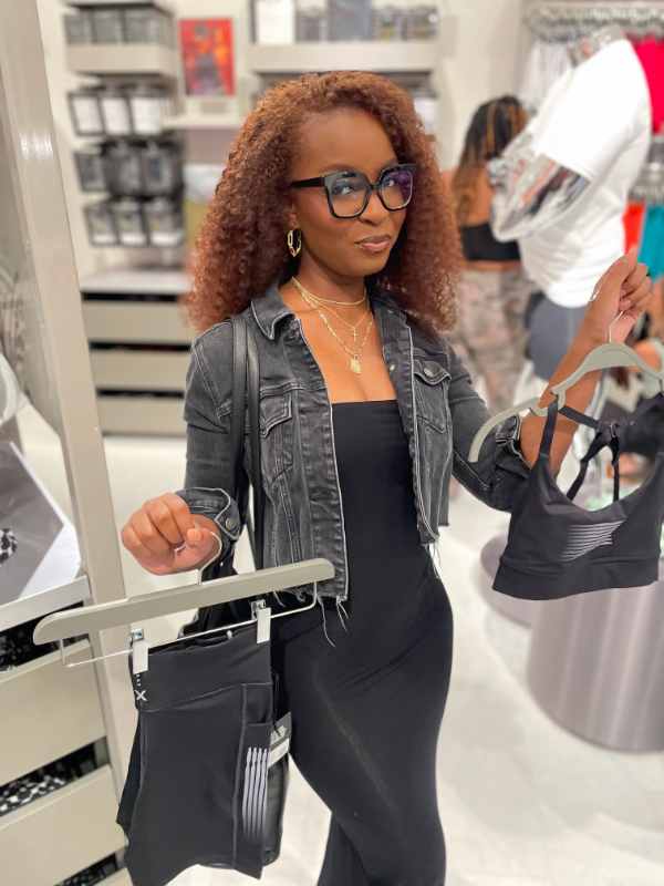 A shopper picks out items at the Savage X Fenty grand opening at Orland Square Mall 