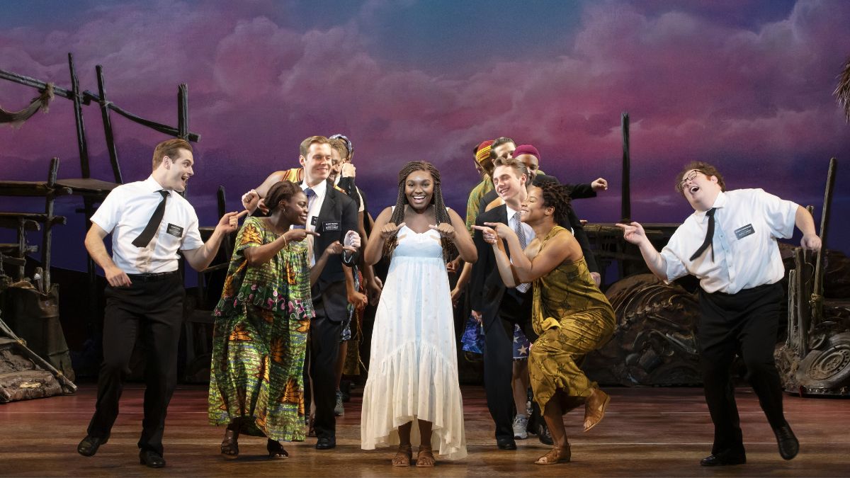 Sam McLellan, Keke Nesbitt, Sam Nackman, and company in THE BOOK OF MORMON North American tour.