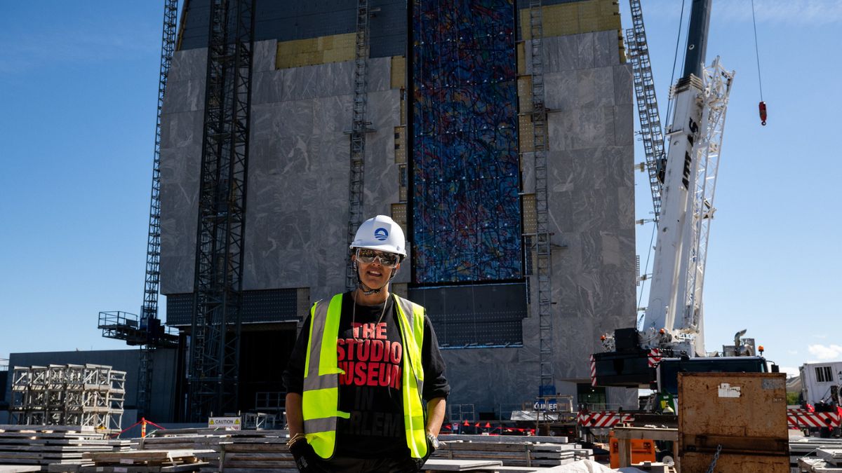 Artist Julie Mehretu tours the Obama Presidential Center site during the installation of her commissioned artwork, an 83-foot-tall painted glass window titled “Uprising of the Su