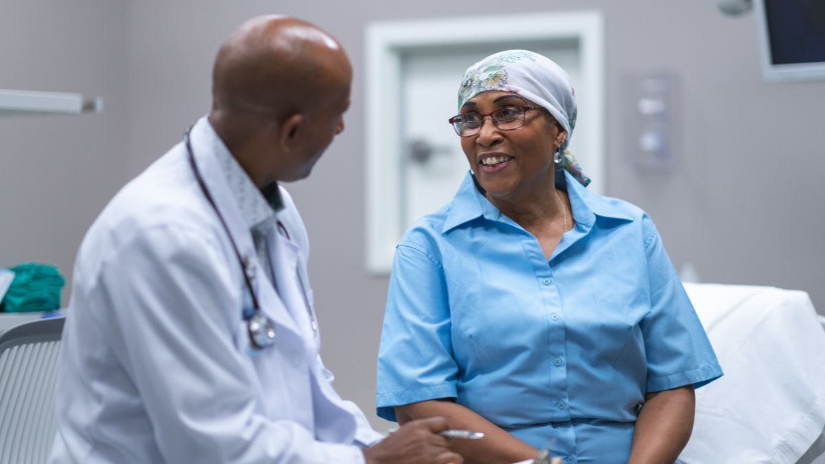 Black cancer disparities Black woman with cancer in medical consultation
