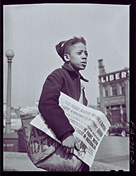 Newsboy selling The Chicago Defender. Public Domain. (1)